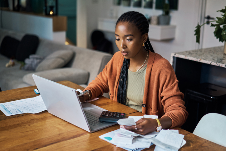 woman calculating finances at home