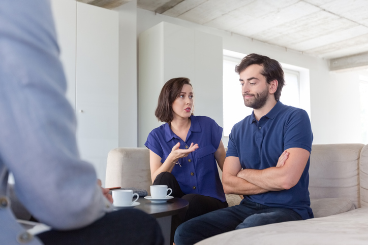 couple having a serious discussion with a professional